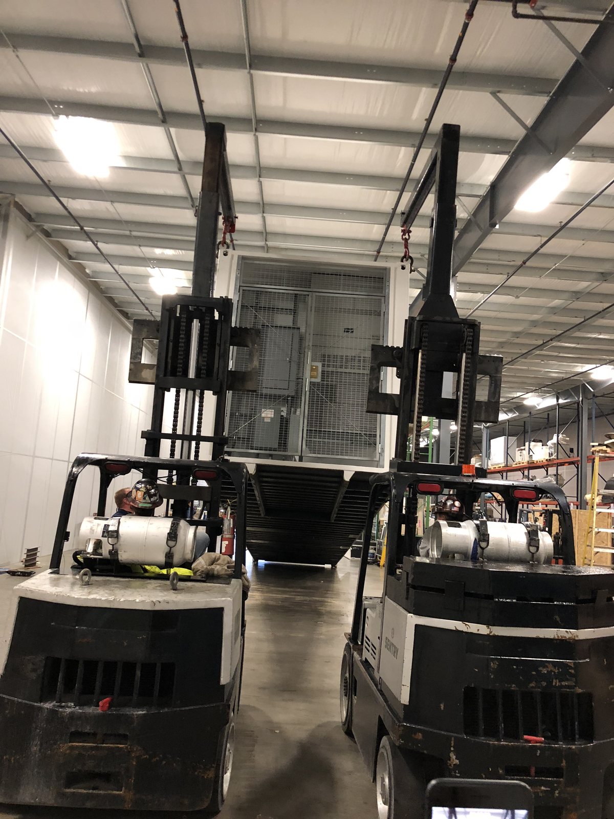 CT gantry moved by forklift in the shop